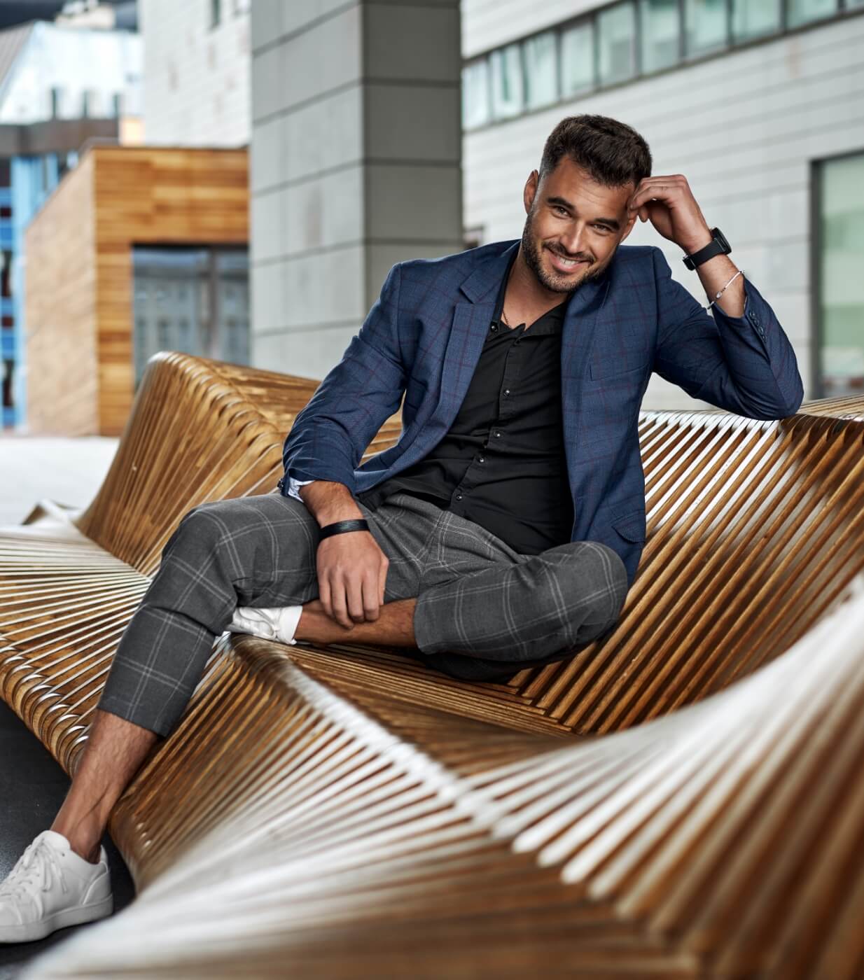 man sitting on a modern outdoor area