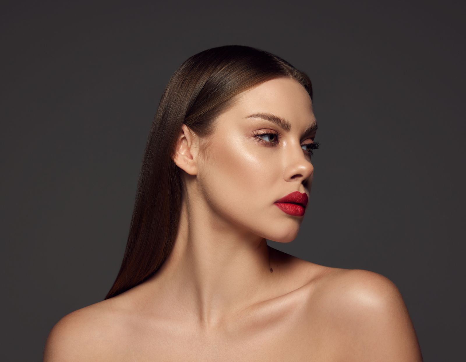 woman with beautiful skin against a dark background